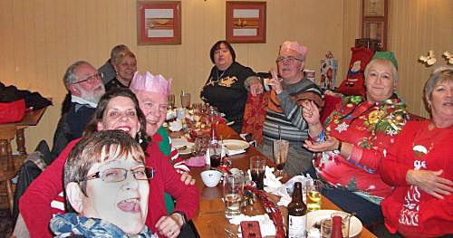 Members of Fleet Lions Club join with Aldershot Lions at the 2018 Christmas Social.