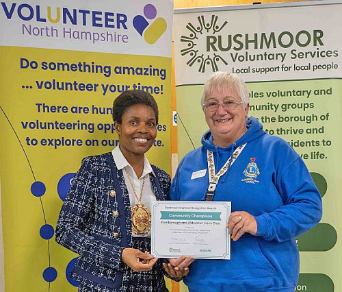 Carol Cross receives the award certrifictae from the Mayor of Rushmoor Councillor Mara Makunura