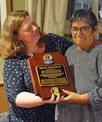 Lion Laura Robert presents the highest award in Lionism - a Melvin Jones Fellowship to Lion Carole Hambleton as a tribute to her husband Ian. 