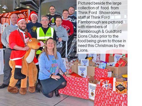 Staff from Think Ford and members of Farnborough & Guildford Lions Club pictured in 2017 with the donated food for less fortunaye families at Christmas