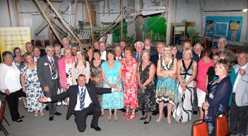 Farnborough Lions and their guests pictured in front of the Cody Flyer at the FAST Museum