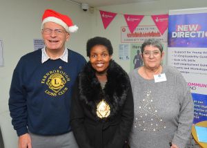 Members of farnborough & Aldershot Lions Club are pictured talking to the Mayor of RshmoorCouncillor Mara Makunura