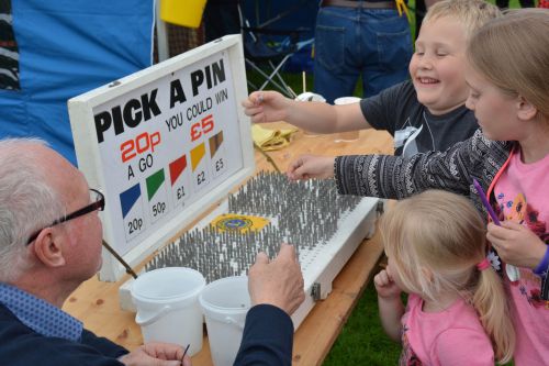 Children enjoy the Pick a Pin game while helping to raise funds for the Lions community work in Farnborough